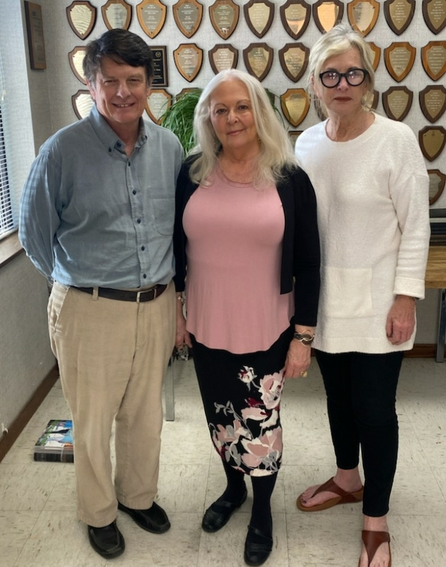 Northside Sun publisher Wyatt Emmerich and editor Jimmye Sweat with Maxine in the middle.