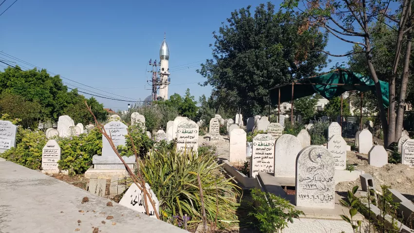 A powerline, a cell tower and a graveyard.
