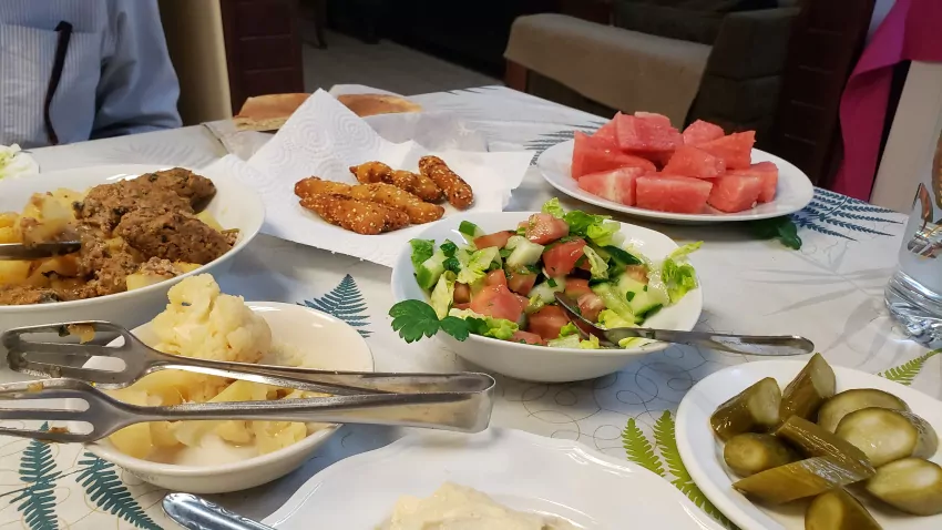 The family made us dinner. We sat at their dinner table and ate real home-grown, ordinary Mediterranean food.