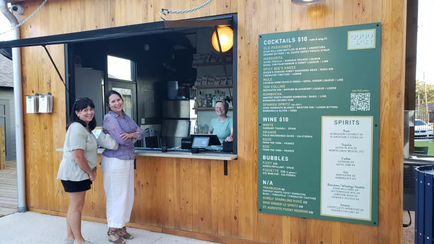 Jackie Moore and Ginny Emmerich check out wine and drink bar.