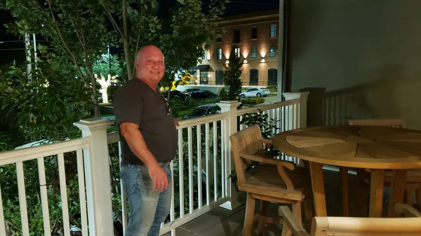 J. P. Milam on Speed's outdoor balcony overlooking the block.