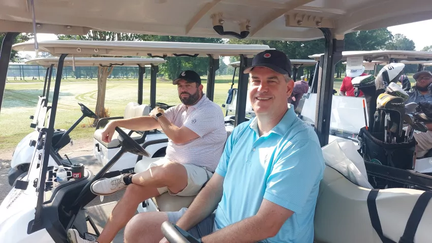 We shot nine under. The pro said we won! 