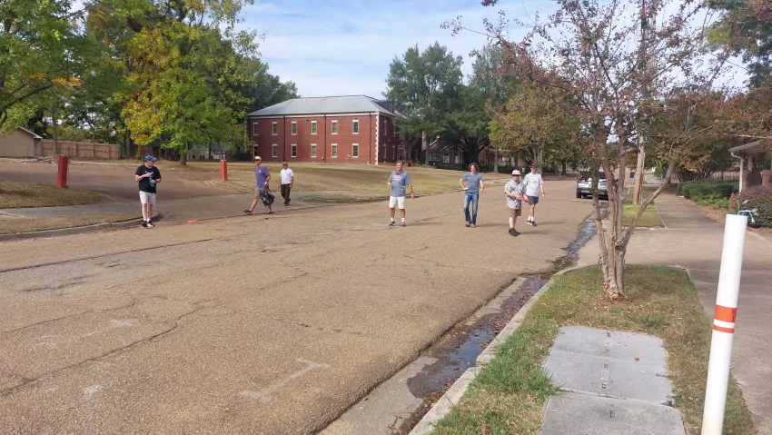Not many people downtown on a Sunday afternoon but those that are don't know what to make of this roving band of frisbee flingers.
