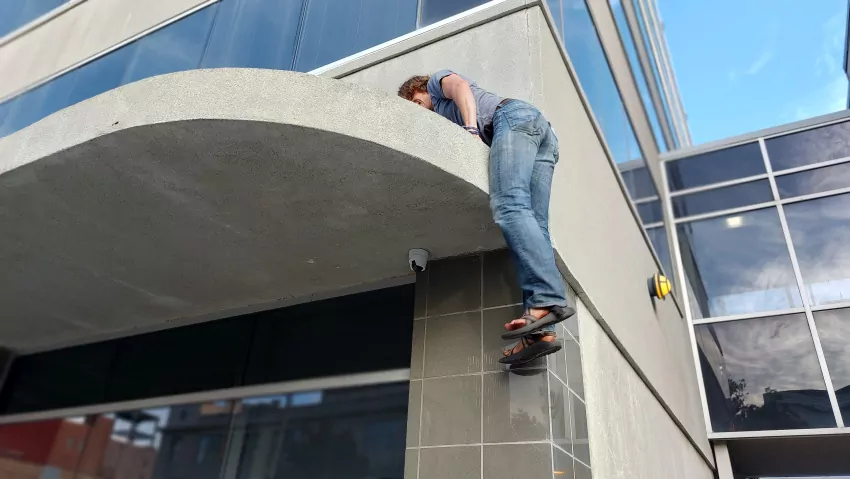 Daniel Trussell retrieves a roofed frisbee. It's nice to see this tradition getting handed off to a new generation. 