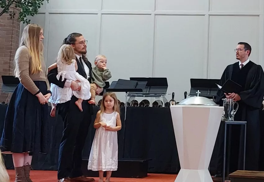 The Mansfield children get baptized. 