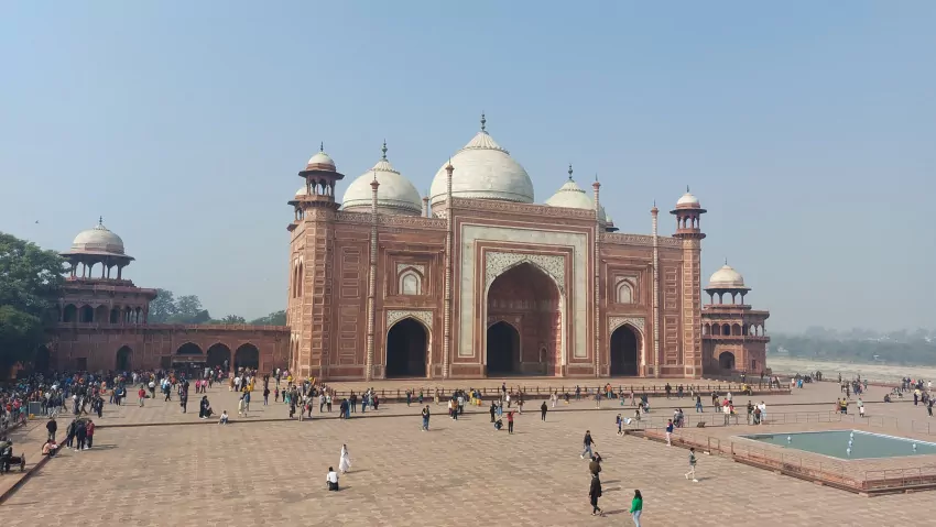 Two side buildings. One a guest house. The other a mosque. 