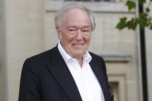 British actor Michael Gambon arrives in Trafalgar Square, in central London, for the world premiere of "Harry Potter and The Deathly Hallows: Part 2," the last film in the series, on July 7, 2011. Gambon, who was known to many for his portrayal of Hogwarts headmaster Albus Dumbledore in six of eight “Harry Potter” films, died. He was 82. A statement by his family, issued by his publicist on Thursday, Sept. 28, 2023, said he died following “a bout of pneumonia.” (AP Photo/Joel Ryan, File)