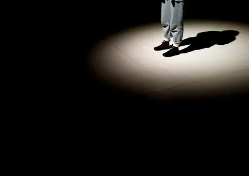 A shadow is cast on the stage of the Trafo House of Contemporary Arts while technicians set up the lighting in Budapest, Hungary, Sept. 19, 2022. Theaters and other cultural institutions in Hungary are reeling from exponentially growing energy prices, and some plan to close for the winter to avoid the skyrocketing bills. The Erkel Theatre in the capital of Budapest will close in November after its utilities went up as much as tenfold, and local governments across the country have ordered theater