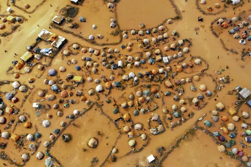 Huts made of branches and cloth provide shelter to Somalis displaced by drought on the outskirts outskirts of Dollow, Somalia, Sept. 19, 2022. Battling droughts, sandstorms, floods, wildfires, coastal erosion, cyclones and other weather events exacerbated by climate change, the African continent needs to adapt, but it needs funds to do so. It’s one of the main priorities for the African Group of Negotiators at the United Nations climate summit, known as COP27, currently underway in Egypt. (AP 