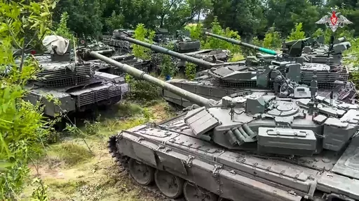 In this photo released by Russian Defense Ministry Press Service on Wednesday, July 12, 2023, Tanks belonging to Russia's Wagner military contractor are parked ahead of their handover to the Russian military at an undisclosed location. The Russian Defense Ministry said that Wagner Group is completing the handover of its weapons to the Russian military. The move follows Wagner's short-lived mutiny last month that challenged the Kremlin. (Russian Defense Ministry Press Service via AP)