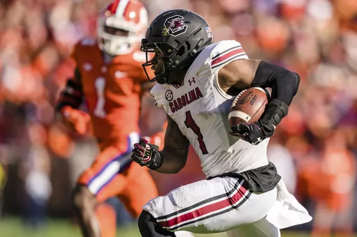 South Carolina running back MarShawn Lloyd (1) runs with the ball during an NCAA college football game against Clemson on Saturday, Nov. 26, 2022, in Clemson, S.C. South Carolina coach Shane Beamer lost some key contributors from the Gamecocks' eight-win team to the transfer portal this offseason including leading rusher MarShawn Lloyd to Southern California. (AP Photo/Jacob Kupferman, File)
