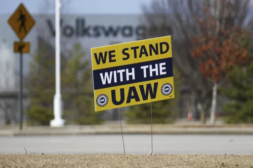 A "We stand with the UAW" sign appears outside of the Volkswagen plant in Chattanooga, Tenn., on Dec. 18, 2023. Workers at at the Tennessee factory are scheduled to finish voting Friday, April 19, 2024, on whether they want to be represented by the United Auto Workers union. (Olivia Ross/Chattanooga Times Free Press via AP, File)