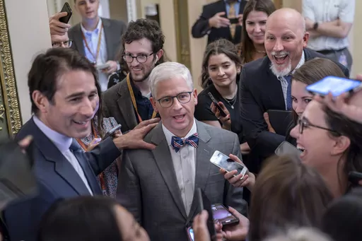 Top Republican debt crisis mediators Rep. Garret Graves, R-La., left, and Rep. Patrick McHenry, R-N.C., center, chairman of the House Financial Services Committee, with Rep. Chip Roy, R-Texas, upper right, have a laugh as they stop for questions by reporters on progress in the talks with the Biden administration, at the Capitol in Washington, Tuesday, May 23, 2023. Rep. Chip Roy, R-Texas, a member of the conservative House Freedom Caucus, has blasted the tentative debt ceiling deal struck by Spe