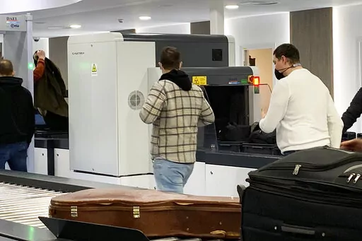 Passengers walk next to Nuctech security scanners at the Brussels Eurostar train terminal on Monday, Jan. 17, 2022. A growing number of Western security officials and policymakers fear that China could exploit Nuctech equipment to sabotage key transit points or get illicit access to government, industrial or personal data from the items that pass through its devices. Nuctech dismisses those concerns, countering that its European operations comply with local laws, including strict security checks