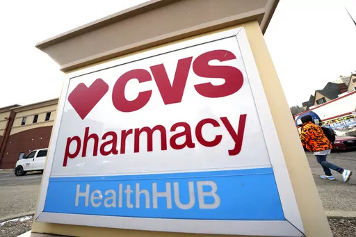 A CVS store sign is displayed in Pittsburgh on Friday, Feb. 3, 2023. CVS Health is plunging deeper into primary care services, buying Oak Street Health for approximately $10.6 billion. The drugstore chain said Wednesday, Feb. 8, 2023, it would pay $39 per share in cash for each share of Oak Street Health in a deal expected to close this year. (AP Photo/Gene J. Puskar)