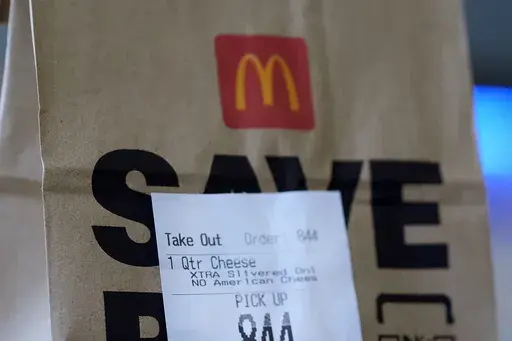 Pictured is a McDonald's bag with an order for a Quarter Pounder sandwich purchased Wednesday, Oct. 23, 2024, in Chicago. (AP Photo/Charles Rex Arbogast)