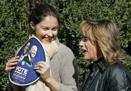 Actress Ashley Judd, left, talks with Valerie Biden Owens, sister of Democratic vice presidential candidate, Sen. Joe Biden, D-Del., during a Women For Obama event in Chapel Hill, N.C., Oct. 30, 2008. Judd is adding her voice to calls for President Joe Biden to step aside from the presidential race following his performance in last month's debate. Judd wrote in an opinion piece for USA Today on Friday, July 12, 2024 that she worries the Democrat could lose to Republican Donald Trump in November.