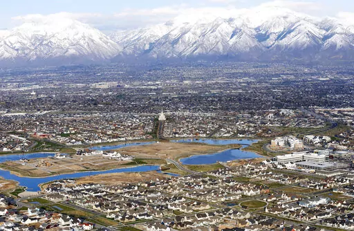 Homes in suburban Salt Lake City are shown, April 13, 2019. According to estimates released Thursday, Dec. 22, 2022, by the U.S. Census Bureau, the U.S. population grew by 1.2 million people this year, with growth largely driven by international migration, and the nation now has 333.2 million residents. (AP Photo/Rick Bowmer, File)