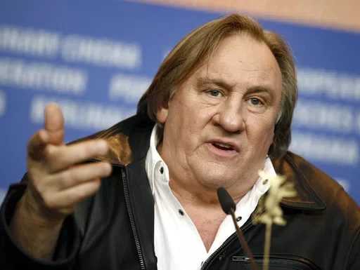 Actor Gerard Depardieu addresses the media during the press conference for the film 'Saint Amour' at the 2016 Berlinale Film Festival in Berlin, Germany, Friday, Feb. 19, 2016. French media are reporting that police have summoned actor Gérard Depardieu for questioning about allegations made by two women that he sexually assaulted them on movie sets. Broadcaster BFMTV and the daily Le Parisien both reported that the 75-year-old actor was called in for police questioning in Paris on Monday, April