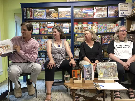 Vermont Lt. Gov. David Zuckerman reads the book "And Tango Makes Three," at Bridgeside Books in Waterbury, Vt., Aug. 13, 2023, as part of his banned book reading tour. (AP Photo/Lisa Rathke)