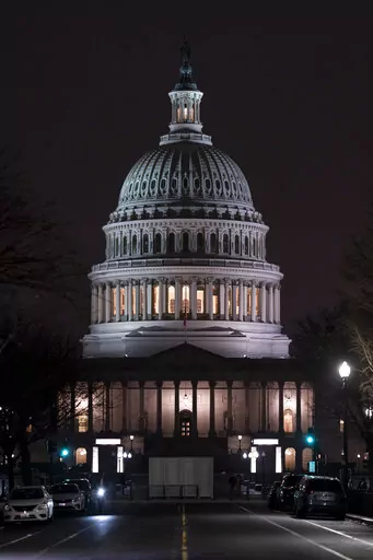The Capitol is seen Wednesday evening as the House of Representatives works to approve the Respect for Marriage Act, a bill already passed in the Senate to codify both interracial and same-gender marriage, in Washington, Dec. 7, 2022. (AP Photo/J. Scott Applewhite)