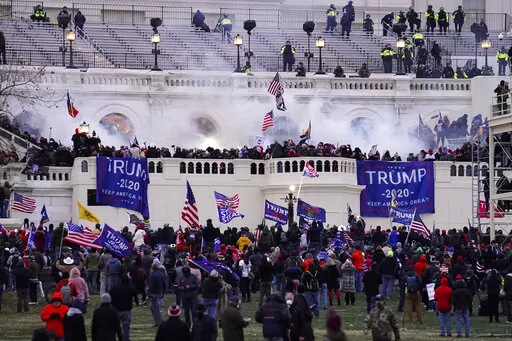 Violent rioters, loyal to President Donald Trump, storm the Capitol in Washington, Jan. 6, 2021. Opening statements are expected to begin Monday, Dec. 12, 2022, in the second seditious conspiracy trial against members of the far-right Oath Keepers extremist group charged in the Jan. 6, Capitol attack. The defendants facing jurors in the latest trial are Joseph Hackett, Roberto Minuta, David Moerschel, and Edward Vallejo. (AP Photo/John Minchillo, File)