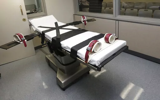 This photo shows the gurney in the the execution chamber at the Oklahoma State Penitentiary in McAlester, Okla., on Oct. 9, 2014. A federal judge in Oklahoma on Monday, June 6, 2022, ruled the state's three-drug lethal injection method is constitutional, paving the way for the state to request execution dates for more than two dozen death row inmates who were plaintiffs in the case. (AP Photo/Sue Ogrocki, File)