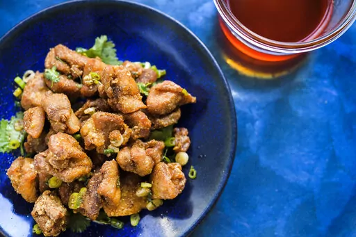 This image released by Milk Street shows a recipe for Crispy Sichuan-Chili Chicken. (Milk Street via AP)