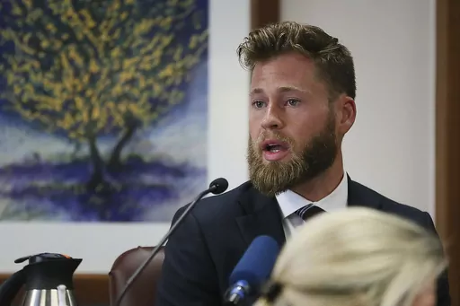 Owen Shroyer, an InfoWars host and sometimes reporter who is a frequent guest on the Alex Jones Show, testifies during Jones' defamation damages trial at the Travis County Courthouse, July 29, 2022, in Austin, Texas. Infowars host Owen Shroyer, who promoted baseless claims of 2020 election fraud on the far-right internet platform, pleaded guilty on Friday, June 23, 2023, to joining the mob of Donald Trump supporters who rioted at the U.S. Capitol. (Briana Sanchez/Austin American-Statesman via AP