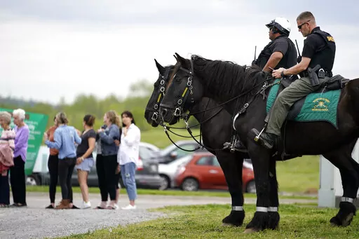 FILE -Officers on horseback guard the entrance to designated demonstrator areas near Riverbend Maximum Security Institution as people wait to enter before the scheduled execution of inmate Oscar Smith, Thursday, April 21, 2022, in Nashville, Tenn. Newly released records show at two least two people connected to a planned Tennessee execution that was abruptly put on hold April 21 knew the night before that the lethal injection drugs the state planned to use hadn’t undergone certain required tes