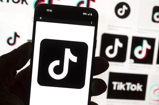 The TikTok logo is seen on a cell phone on Oct. 14, 2022, in Boston. On Thursday, Jan. 12, 2023, Wisconsin became the latest state to ban the use of TikTok on state phones and other devices, a move that comes amid a push for a federal ban and after nearly half of the states nationwide have blocked the popular app. (AP Photo/Michael Dwyer, File)