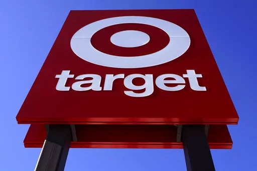 The bullseye logo on a sign outside a Target store is seen on Feb. 28, 2022. Target's first-quarter profit took a big hit from higher costs, despite strong sales growth. Target's results Wednesday, May 18, reflect the pressure on retailers' profits coming from surging inflation and persistent clogs in the supply chain. (AP Photo/Charles Krupa, File)