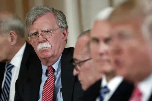 National security adviser John Bolton, left, listens to President Donald Trump, far right, speak during a working lunch with Japanese Prime Minister Shinzo Abe at Trump' s private Mar-a-Lago club, April 18, 2018 in Palm Beach, Fla. (AP Photo/Pablo Martinez Monsivais)