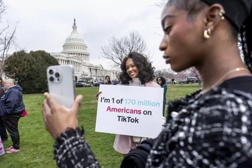 Devotees of TikTok, Mona Swain, center, and her sister, Rachel Swain, right, both of Atlanta, monitor voting at the Capitol in Washington, as the House passed a bill that would lead to a nationwide ban of the popular video app if its China-based owner doesn't sell, March 13, 2024. If some U.S. lawmakers have their way, the United States and China could end up with something in common: TikTok might not be available in either country. (AP Photo/J. Scott Applewhite, File)