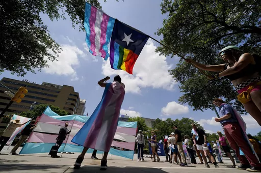 Demonstrators gather on the steps to the Texas Capitol to speak against transgender-related legislation bills being considered in the Texas Senate and House, May 20, 2021, in Austin, Texas. The Texas Supreme Court will allow the new state law banning gender-affirming care for minors to take effect on Friday, Sept. 1, 2023, setting up Texas to be the most populous state with such restrictions on transgender children. (AP Photo/Eric Gay, File)