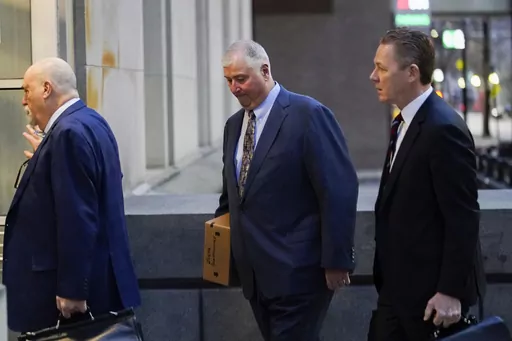 Former Ohio House Speaker Larry Householder, center, walks into Potter Stewart U.S. Courthouse with his attorneys, Mark Marein, left, and Steven Bradley, right, before jury selection in his federal trial, Jan. 20, 2023, in Cincinnati, Ohio. Householder and former Ohio Republican Party Chair Matt Borges were convicted Thursday, March 9, 2023, in a $60 million bribery scheme that federal prosecutors have called the largest corruption case in state history. (AP Photo/Joshua A. Bickel, File)