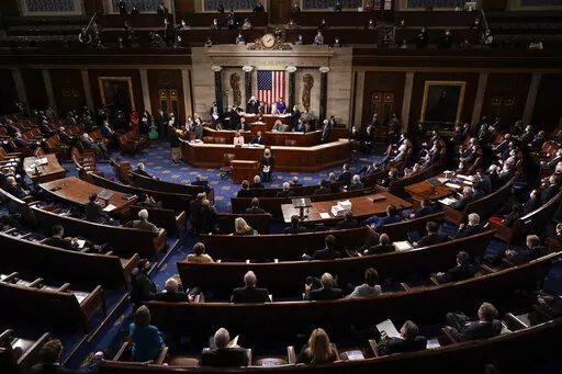 In this Jan. 6, 2021, photo, the Republican side, right, in the House chamber is seen as Speaker of the House Nancy Pelosi, D-Calif., and Vice President Mike Pence officiate as a joint session of the House and Senate convenes to count the Electoral College votes cast in November's election, at the Capitol in Washington. State attorneys general and the House committee investigating the Jan. 6 attack on the Capitol are digging deeper into the role that fake slates of electors played in the despera