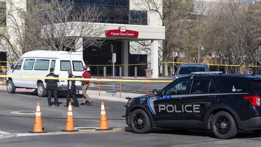 A police vehicle is parked outside Saint Alphonsus Regional Medical Center in Boise, Idaho, on March 20, 2024. Two members of an Idaho white supremacist prison gang, an inmate and the man accused of helping him escape in an armed ambush at a Boise hospital, are due in court for a preliminary hearing Monday, April 8, along with a woman who is accused of providing a vehicle they used during their 36 hours on the run. (Sarah A. Miller/Idaho Statesman via AP, File)