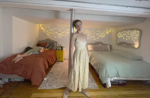 Erin Eloise Tulberg poses at home in the Brooklyn borough of New York on May 29, 2024, with her 9-year-old son. Tulberg set up a divorce registry after leaving her marriage with little more than her clothes and her books. (Erin Eloise Tulberg via AP)