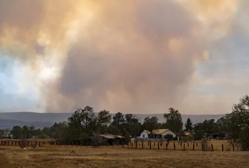 The Calf Canyon/Hermits Peak Fire burns in the hills outside of Las Vegas, N.M., on Saturday, May 7, 2022. (Robert Browman/The Albuquerque Journal via AP)