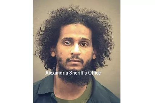 In this photo provided by the Alexandria Sheriff's Office is El Shafee Elsheikh who is in custody at the Alexandria Adult Detention Center, Oct. 7, 2020, in Alexandria, Va.   Elsheikh has been sentenced to life in prison for his role in the deaths of four U.S. hostages captured by the Islamic State. Prosecutors say El Shafee Elsheikh is the most notorious member of the Islamic State ever to be convicted at trial in a U.S. court. (Alexandria Sheriff's Office via AP, File)