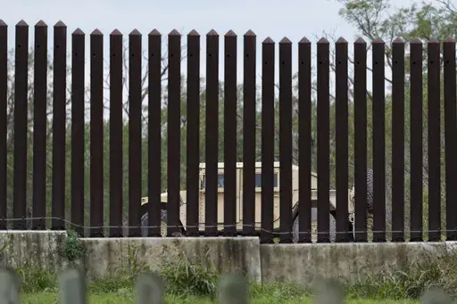 A national guardsman patrols along a stretch of boarder wall, Tuesday, Jan. 21, 2025, in Brownsville, Texas. (AP Photo/Eric Gay)