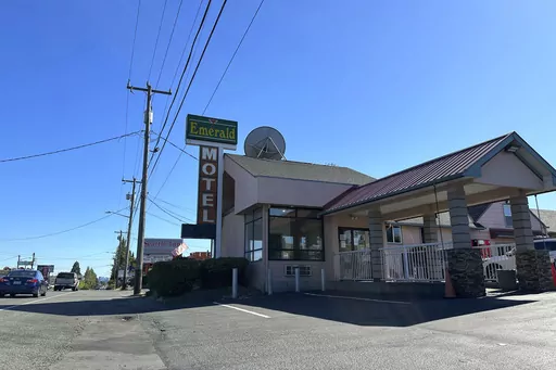 Cars pass by the Emerald Motel and Seattle Inn on Aurora Avenue North in Seattle, on Thursday, Aug. 3, 2023. Police recently declared the establishments to be chronic nuisances due to rampant prostitution and other criminal activity, a step that requires the owners to demonstrate how they will prevent their properties from being used for criminal behavior. The recent harrowing escape of a woman who was abducted after engaging in prostitution on Seattle has helped focus attention on the consequen