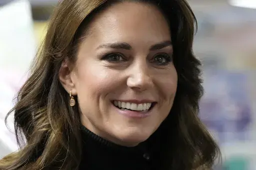 Britain's Kate, Princess of Wales smiles as she speaks to a woman during her visit to Sebby's Corner in north London on Nov. 24, 2023. (AP Photo/Frank Augstein, Pool, File)
