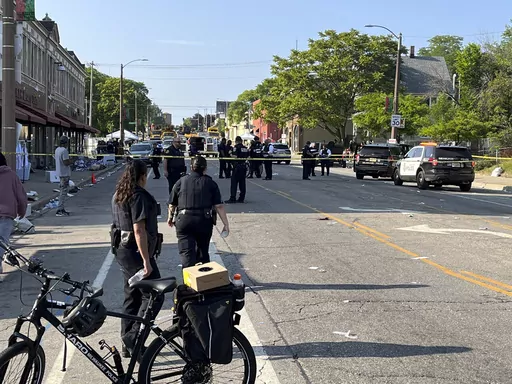 Milwaukee police investigate a shooting along North King Drive near Locust Street, in Milwaukee, Monday, June 19, 2023. At least six people were shot around where Milwaukee’s Juneteenth celebration had just wrapped up, according to Milwaukee police and fire officials. (Bill Glauber/Milwaukee Journal-Sentinel via AP)