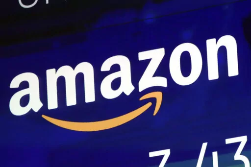 The logo for Amazon.com Inc. is displayed on a screen at the Nasdaq MarketSite, July 27, 2018.  House lawmakers have made good on their threat to seek a criminal investigation of Amazon, asking the Justice Department Wednesday to investigate whether Amazon and its senior executives obstructed Congress or violated other laws in testimony on the tech giant’s competition practices. The bipartisan battle against the world’s biggest online retailer by the House Judiciary Committee escalated with 