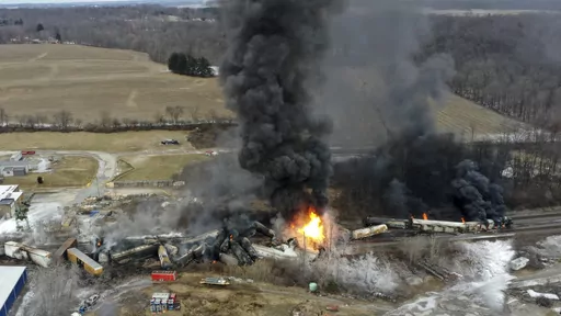 This photo taken with a drone shows portions of a Norfolk and Southern freight train that derailed Friday night in East Palestine, Ohio are still on fire at mid-day Saturday, Feb. 4, 2023. Soon after the train derailed and spilled toxic chemicals in Ohio last month, anonymous pro-Russian accounts started spreading misleading claims and anti-American propaganda about it on Twitter, using Elon Musk's new verification system to expand their reach while creating the illusion of credibility. (AP Phot