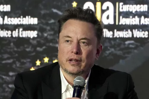 Elon Musk addresses the European Jewish Association's conference, in Krakow, Poland, Monday, Jan. 22, 2024. Musk is suing OpenAI and its CEO Sam Altman, Thursday, Feb. 29, over what he says is a betrayal of the ChatGPT maker's founding aims of benefiting humanity rather than pursuing profits. (AP Photo/Czarek Sokolowski, File)