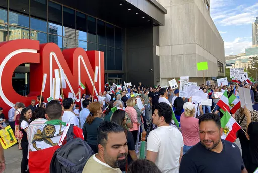 Iranian Americans demonstrate in support of protesters in Iran on Sunday, Sept. 25, 2022, in Atlanta The demonstration comes amid violent unrest in Iran triggered by the death of a young woman in police custody. (AP Photo/Jeff Amy)
