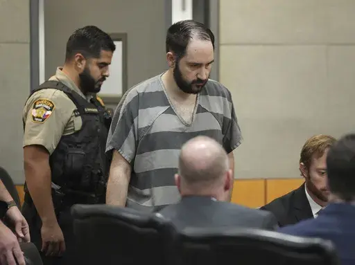 Daniel Perry enters the courtroom at the Blackwell-Thurman Criminal Justice Center, May 10, 2023, in Austin, Texas. The Texas Board of Pardons and Paroles on Thursday, May 16, 2024, recommended a full pardon for Perry, a former U.S. Army sergeant convicted of murder for fatally shooting an armed demonstrator in 2020 during nationwide protests against police violence and racial injustice. (Jay Janner/Austin American-Statesman via AP, Pool, File)